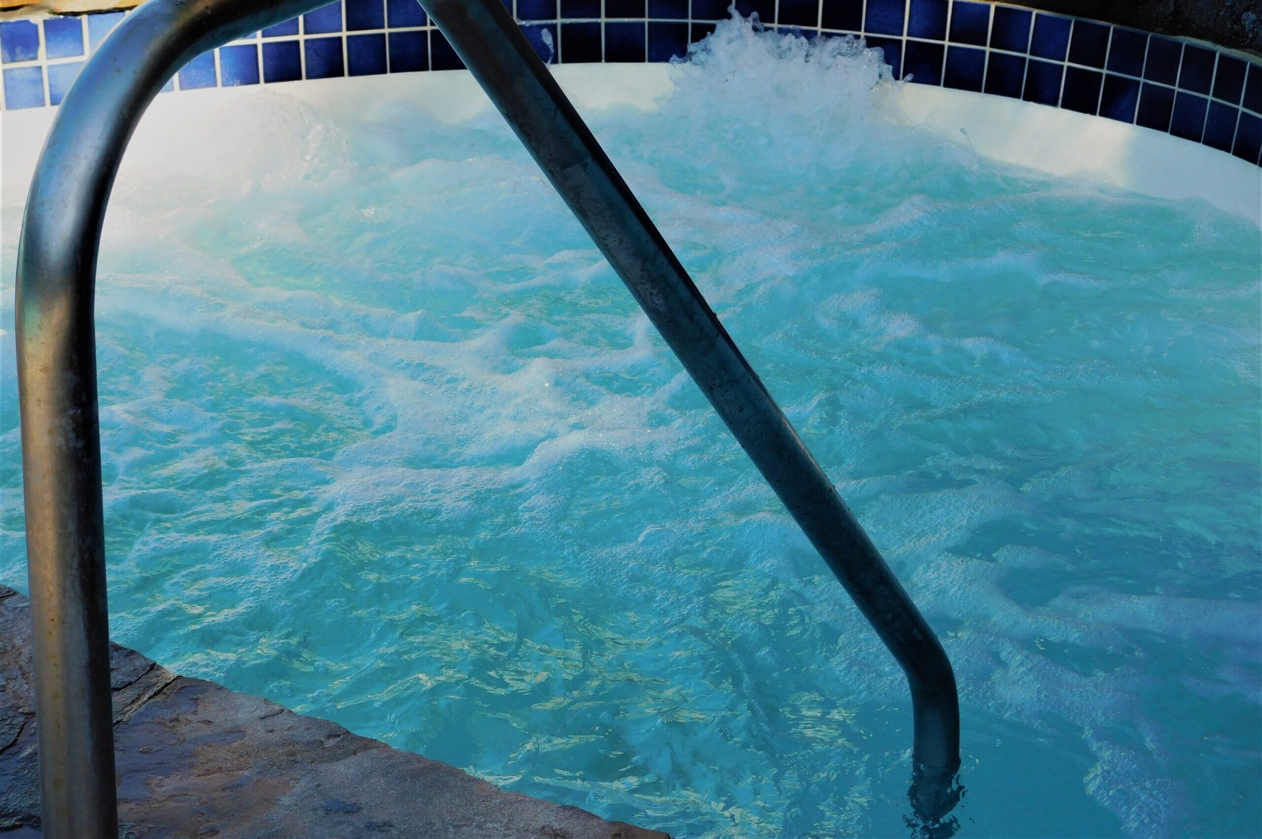 backyard-living-an-inground-hot-tub-with-swirling-2022-11-08-05-37-47-utc